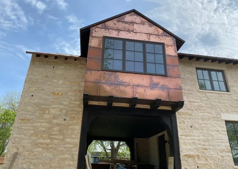Copper metal panel facade on a stone building for Metal Roof Coating in Beckley